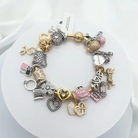 Linx Yellow Gold Bracelet with Gold Silver and Pink Nurse Girlfriend Charms